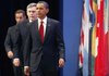 President Barack Obama is followed by British Prime Minister Gordon Brown and French President Nicolas Sarkozy as they prepare to deliver a statement Friday on Iran's nuclear facility during the G-20 summit in Pittsburgh.