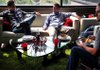 Creative director Joey Nelson of Fayetteville, left, director of technology John Cox of Rogers and senior developer Shawn Camp of Siloam Springs sat in the lounge area at the Rockfish Interactive office in Rogers. 

