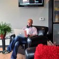 Designer Brian Burton of Rogers worked from his laptop computer in the kitchen and lounge area at Ro...