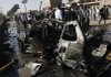 A damaged vehicle is seen at the site of a blast in Herat, Afghanistan on Sunday.