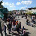 Motorcyclists and pedestrians make their way along West Dickson Street during the 10th annual Bikes,...