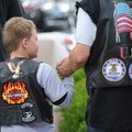  Mickey Curtis of Tulsa, Okla., holds the hand of his grandson, Joseph, 8, while walking down West D...
