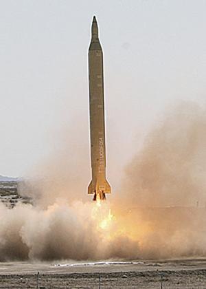 An Iranian Shahab-3 missile is launched Monday during a drill at an undisclosed location in this photo released by the Iranian semiofficial Fars News Agency.