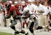 Alabama running back Mark Ingram breaks away from Arkansas defensive back Ramon Broadway during Saturday's game in Tuscaloosa, Ala. Broadway is one of several Razorbacks who have given up big plays in the secondary.