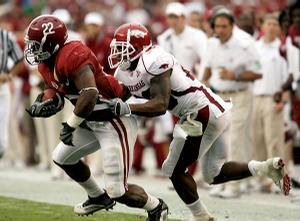 Alabama running back Mark Ingram breaks away from Arkansas defensive back Ramon Broadway during Saturday's game in Tuscaloosa, Ala. Broadway is one of several Razorbacks who have given up big plays in the secondary.