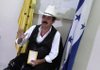 Honduras' ousted President Manuel Zelaya, holding a copy of the Honduran Constitution, speaks during a press conference at the Brazilian embassy in Tegucigalpa, Monday.