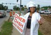 Sandra Barth dances Thursday in front of Diner Dash on Wedington Drive in Fayetteville. Barth, who works for owners Tommy and Nikki Golden, dances to bring in customers and because she enjoys it. 