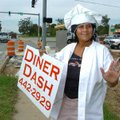 Sandra Barth dances Thursday in front of Diner Dash on Wedington Drive in Fayetteville. Barth, who w...