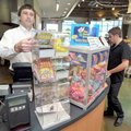 Tim Pennington, left, pulled out some scratch-off tickets for Calvin Clary at the White Oak Station ...