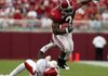 Alabama running back Trent Richardson (3) runs past Arkansas' Andre Stewart during last week's game. Richardson was selected as the SEC freshman of the week after rushing for 65 yards on nine carries, including a 52-yard touchdown run.