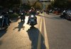 Bikers ride up and down Dickson Street on Friday evening in Fayetteville during the annual biker fest Bikes, Blues & BBQ. Around 400,000 people were expected to attend this year's rally. 
