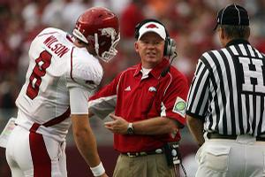 Arkansas Coach Bobby Petrino talks with linesman Johnny Crawford about one of the 11 penalties assessed against the Razorbacks in Alabama's 35-7 victory Saturday. Arkansas and Texas A&M are two of the most heavily penalized teams in the nation.