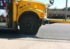A Fayetteville School District bus driver stops to drop off a student along Wedington Drive on Tuesday afternoon after school. Fayetteville and Farmington schools are two of 21 districts that were awarded a grant this month to buy exterior cameras for one of their buses in an effort to identify drivers who don't stop for school buses. 