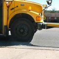 A Fayetteville School District bus driver stops to drop off a student along Wedington Drive on Tuesd...