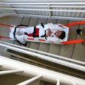 Rogers firefighters carried nursing student Hope Helton down six flights of stairs in an evacuation ...