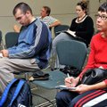 David Krueger, left, of Rogers and Debra Weaver of Rogers took notes while attending a free resume w...