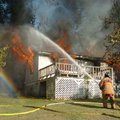 <b>Trailer fire</b>
West Fork volunteer firefighters work to keep fire in a mobile home from spread...