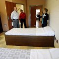 Cathy Davis (right), community relations liaison, describes features of patient rooms Wednesday duri...