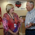 Becky Billings of Prairie Grove talks with WW II veteran John D. Little of Kingston on Wednesday mor...