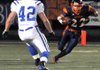 Heritage receiver Travis Entwisle headed upfield after a catch as Rogers linebacker Max Muirhead moved in to make the tackle during Friday's game at Gates Stadium in Rogers. Entwisle had eight catches for 51 yards in the War Eagles' 24-9 win. 

