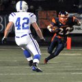 Heritage receiver Travis Entwisle headed upfield after a catch as Rogers linebacker Max Muirhead mov...
