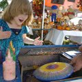 <b>Fun Filled Days</b>
Angela Murray, 5, reacts as she sees her spin art for the first time Friday ...
