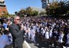 Fayetteville High School football coach Daryl Patton speaks during a pep rally following a parade as a part of FHS' homecoming celebrations Friday on the downtown Square.
