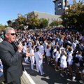 Fayetteville High School football coach Daryl Patton speaks during a pep rally following a parade as...