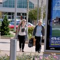Lindley Summers, left, and Samantha Rush shopped at the Pinnacle Hills Promenade in Rogers on Friday...