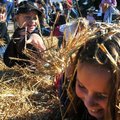 <b>Right time for a hay fight</b> Lily Harvey, center, 8, and her sister, Grace, 9, both of Tulsa, O...