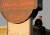 Bentonville Police Detective Mark Jordan sat atop the Krispy Kreme donut shop in Bentonville on Saturday while Lincoln Junior High School volunteers below sold T-shirts and took donations for the Arkansas Special Olympics.