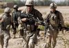 During a firefight with Taliban militants, U.S. Marine Cpl. Matthew Doherty (center) of Bastrop, Texas, runs for a new position with fellow Marines with 3rd Platoon, Bravo Company, 1st Battalion 5th Marines, and an Afghan soldier, and an interpreter (left) in Nawa district, Helmand province, Afghanistan, on Sunday.