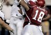 Arkansas running back Ronnie Wingo avoids Texas A&M defender Von Miller on his way to a 62-yard touchdown run in the fourth quarter, ending the Razorbacks' scoring.

