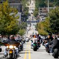 Bikers cruise along Dickson Street in Fayetteville during the 10th annual Bikes, Blues & BBQ Motorcy...
