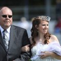 Emily Bishop smiles after being crowned the 2009 Fayetteville High School homecoming queen alongside...
