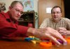 Loyd Smith picks out letters he can remember with reading tutor Jim Mears on Tuesday at the Ozark Literacy Council Inc., located off Sunbridge Drive in Fayetteville. The organization teaches adults to read and write and teaches English as a second language.