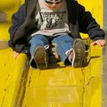 <b>Down the yellow slick road</b>
Isaac Mann, 6, had no problems with a high slide at the second an...