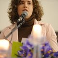 Laura Kellams, Northwest Arkansas director of Arkansas Advocates for Children, speaks Sunday during ...