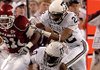 Michael Smith is swarmed by Texas A&M defenders in Arkansas' victory Oct. 3.