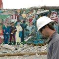 <b>Mural's last days</b>
Jason Combs, with Cox Communications, walks past the "lovely mural" Monday...