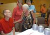 Bob Folsom, left, talks with Marie Easterling, right, and Sharon Mullen, center, during a dedication ceremony for the new Bob Folsom Elementary School on July 13, 2008, in Farmington. Easterling's and Mullen's children were taught by Folsom in his first year of teaching. 