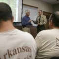 Tops for the year Park employees watch Monday as State Parks Director Greg Butts (left) presents an ...