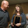Amy Simco, right, with Arvest Bank’s West Fork branch, talks with Kenny Yates, with the Fayetteville...