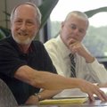 Fayetteville Mayor Lioneld Jordan (left) and Rogers Mayor Steve Womack talk to reporters Tuesday dur...