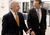 Sen. Pete Conrad (right), D-N.D., a member of the Senate Finance Committee, talks with Sen. Jack Reed, D-R.I., as they head to the Senate chamber on Thursday. Conrad said “it will be months” before a health-care overhaul bill is passed.