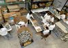 A group of volunteers for Kraft Foods worked in one corner of the Northwest Arkansas Food Bank in Bethel Heights on Thursday morning, sorting and labeling canned goods.