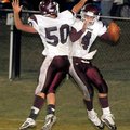 Pioneer teammates Clint James, No. 50, and Justin Stewart celebrated after Stewart’s 41-yard touchdo...