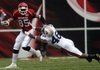 Greg Childs avoids a tackle by Auburn's Craig Stevens against Auburn.
