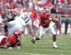 Arkansas tailback Michael Smith runs to the outside against Auburn in the first half Saturday in Razorback Stadium. Smith had 18 carries for 145 yards and one touchdown in the Hogs' 44-23 victory.