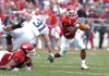 Arkansas tail back Michael Smith runs to the outside against Auburn in the first half Saturday in Razorback Stadium. Smith had eighteen carries for 145 yards and one touchdown in the Hogs 44-23 victory. 

